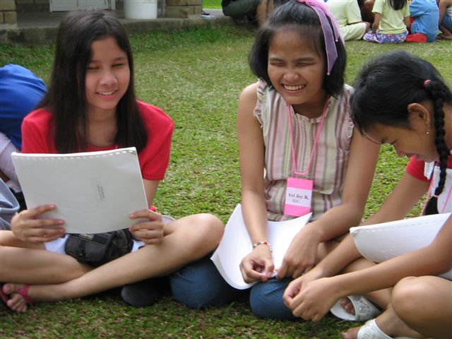 Group of summer camp girls enjoying a discussion